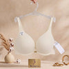Premium textured ribbed fabric
«delicate
gold- tone center charm, supportive contoured cups, and comfortable adjustable straps.